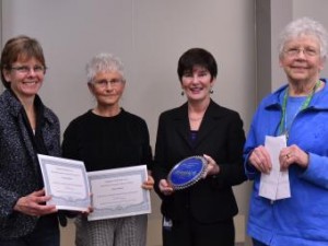 Caption: Photo from left to right: Tracey Swallow & Maria Gunkel receive awards from Anne Harvey and Bett Lauridsen in 2012.