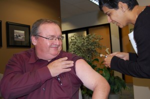 Dr. Patrick O'Connor, vice-president of Medicine, Quality & Safety gets vaccinated.