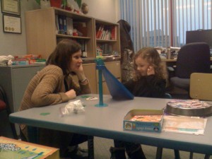 VCH speech language pathologist Kimberly Eggert  working with Imogen at North Shore Community Health Center.