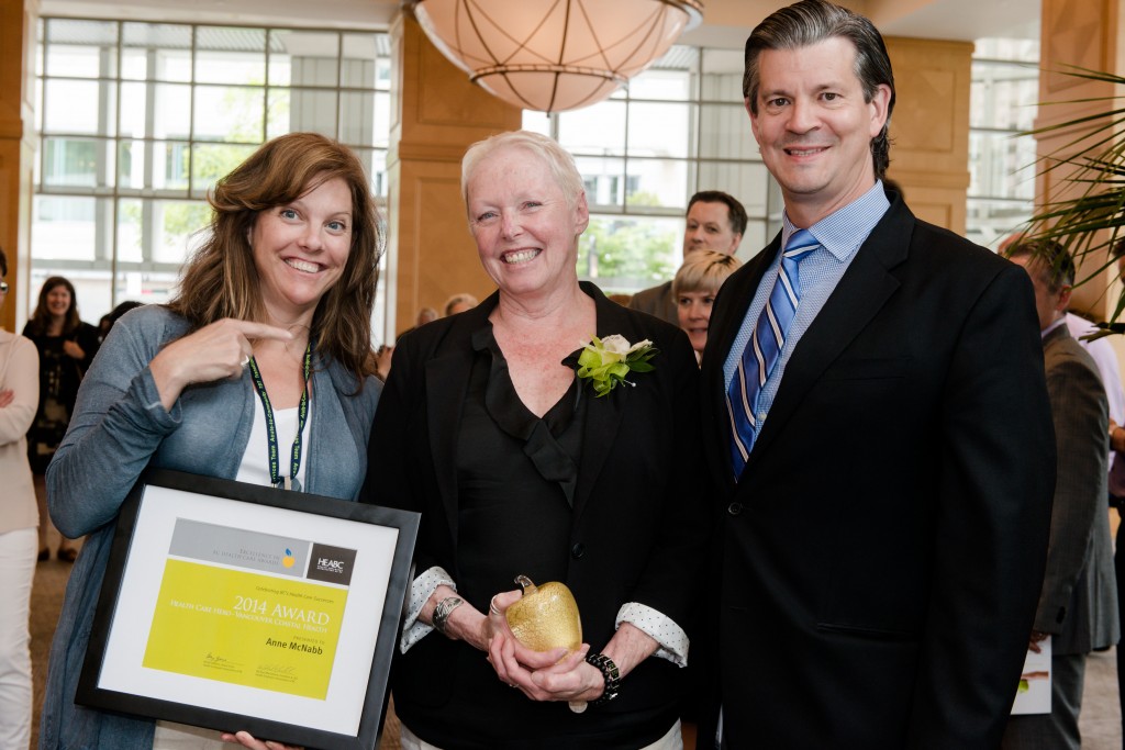 Anne receives her award Monday. Pictured left to right: Laura Case, COO, Vancouver Community; Anne McNabb; Andrew MacFarlane, Director MH&A Urban.  