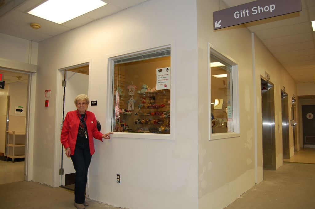 Long time Auxilian Ellen PXXX stands outside the current, temporary location.