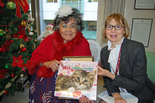 Banfield resident Emily Julian, pictured with Sharon Galloway, resident services manager, is very fond of cats and tickled pink with her new calendar.