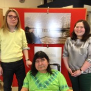 Students David and Maria with GPC resident Greg in front of the photographic art piece, Fraser River