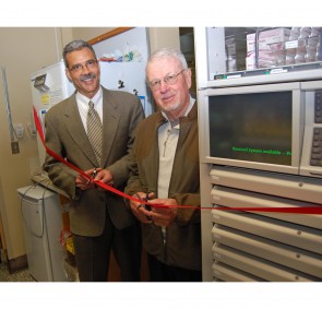 (l-R) Mark Collins, CST LGH Pharmacy Project Lead, and Bob Morrison, LGH Auxiliary Co-President, joined forces in the ceremonial ribbon cutting that marked the implementation of the Omnicell Project at LGH. The Auxiliary generously donated funds to purchase two Omnicell cabinets.