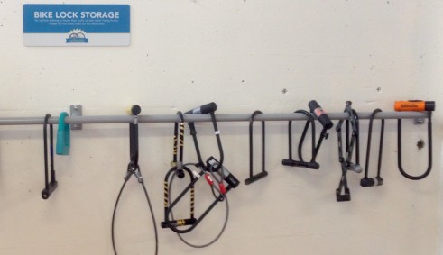 Bike lock storage rack for those who wish to leave their lock in the cage.