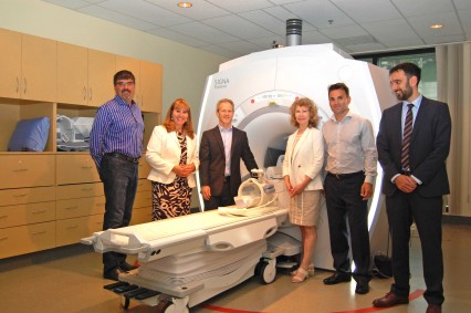 Members of the Sander family, along with Judy Savage, LGH Foundation President and Dr. Kevin Rowan, LGH Director of Diagnostic Imaging, show off the new MRI.