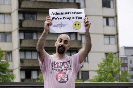 Mike Nader, COo-Coastal, held up a sign for each time he was dunked, which was often.