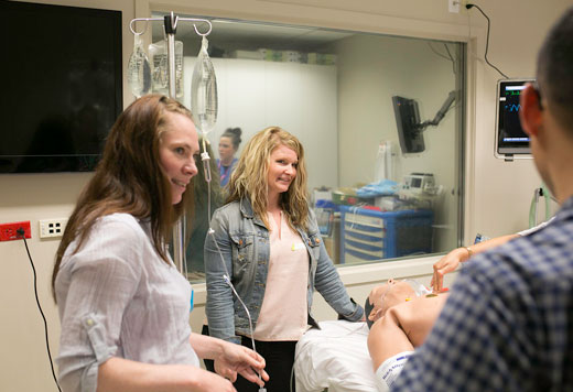 Left to right: Breanna Curley, ICU RN, and Heather Johnson, RT, as they learn more about treating potential anaphylaxis on the ward from their Emergency Department colleagues. 