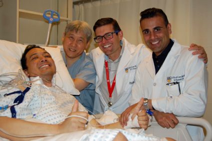 Willie in the ICU following transplant with (l to r): Drs. John Yee, Gord Finlayson and Hussein Kanji.
