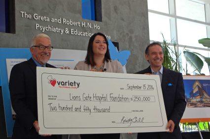 Lions Gate Hospital Foundation co-vice chair Pierre Label (l) and Dr. Jordan Cohen (r) accept a $250,000 cheque from ?? of the Variety Children's Charity.