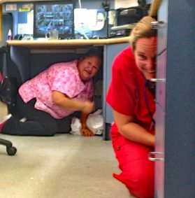 RN Susan Chatelier (in red) and patient care aid Doris Windsor take cover at R.W.Large Memorial Hospital.