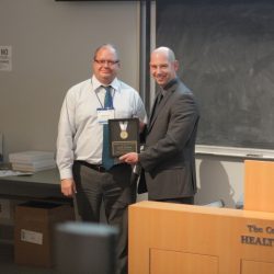 IPS Director, Dave Brown, accepts Medal of Distinction from IAHSS Co-Chair, Scott MacMillan 