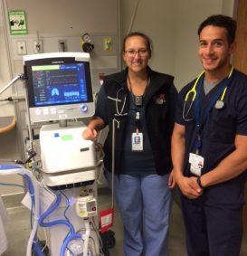 Cassandra Ivey and student Abdul Murad show off a new Hamilton G5 ventilator.