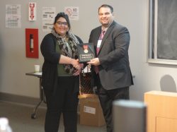 Paladin Security Officer, Shima Yazdani accepts Medal of Valor from IAHSS Chair, Tom Molin