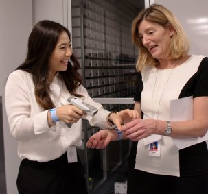 Mary Ackenhusen gets first-hand experience of barcode scanning courtesy of CST Device team member Katherine Wong at the Grand Opening of the Vancouver Pharmacy Production Centre.