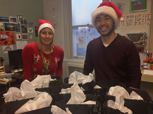 Stephanie Mehlenbacher and Stephen Wong, VGH Health Centre occupational therapists, display the Christmas gifts and patient care packages funded by the VGH Thrift Store.