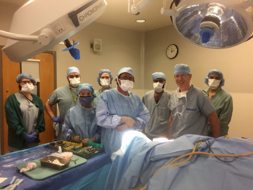 Dr. Chris Honey and team in the OR and prepared make neurosurgical history at UBCH.